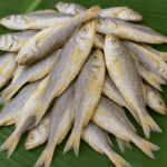 generated-whole-dry-fish-product-image-on-banana-leaf_f81aff21-1c91-4115-bf7b-930e81603bc8